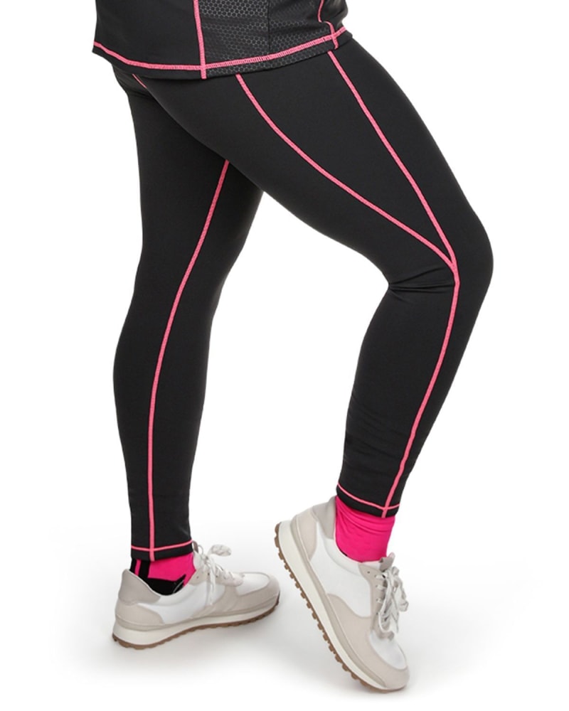 Side of a model wearing a size L Solid Moisture Wicking Legging With Neon Stitching in Black by Memoi. | dia_product_style_image_id:299597